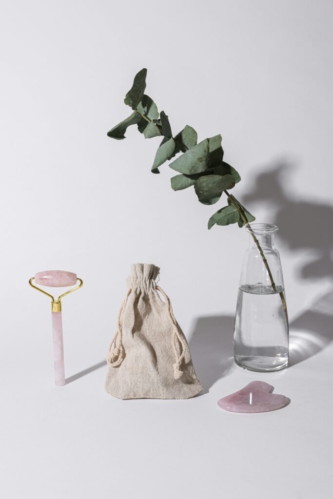 pexels-photo-8015882-8015882 Elegant arrangement of spa tools and eucalyptus leaf on a white background.